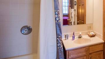 Jetted bath, hair dryer, towels, soap