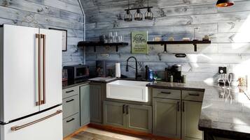 Fridge, stovetop, coffee/tea maker, cookware/dishes/utensils