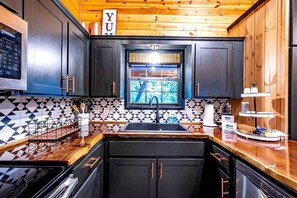 Microwave, stovetop, coffee/tea maker, electric kettle