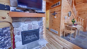 TV, fireplace - Rustic Log Cabin Escape in Logan, Ohio, with Hot Tub and Infrared Sauna (Logan)