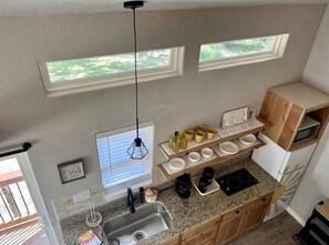 Fridge, stovetop, coffee/tea maker, cookware/dishes/utensils