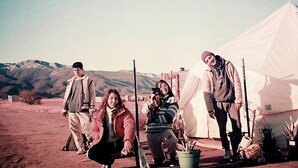 A group of people standing in front of a tent in a desert-like environment. - Glamorous California Campsite Retreat with Great Views (New Cuyama)