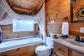 Jetted tub, towels, toilet paper