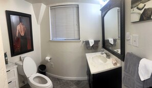 Jetted tub, hair dryer, towels, toilet paper