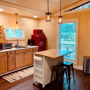 Fridge, microwave, stovetop, coffee/tea maker