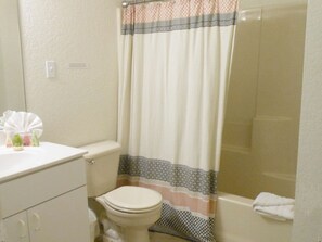 Jetted bath, hair dryer, towels, soap