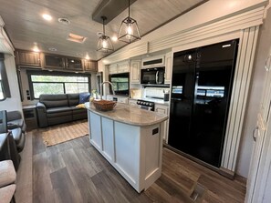 Fridge, microwave, stovetop, coffee/tea maker