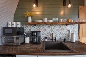 Fridge, coffee/tea maker, cookware/dishes/utensils