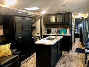 Fridge, microwave, stovetop, coffee/tea maker