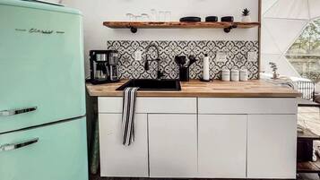 Fridge, coffee/tea maker, cookware/dishes/utensils