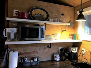 Fridge, microwave, coffee/tea maker, dining tables