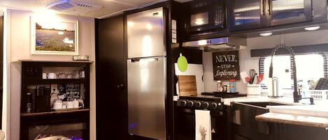 Fridge, stovetop, coffee/tea maker, cookware/dishes/utensils