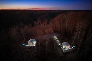 A remote cabin with a small deck and a large dome structure. - Lakefront Dome with Private Deck and Amazing Hiking Trails in Tennessee (Smithville)