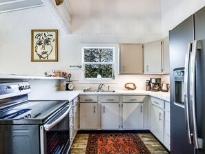 Fridge, microwave, stovetop, coffee/tea maker