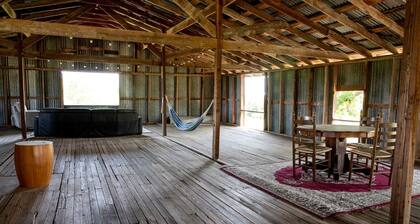 Hobbit Treehouse with Waterfall on the Brazos River for Glamping in Texas
