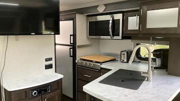 Fridge, stovetop, coffee/tea maker, cookware/dishes/utensils