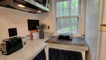 Fridge, coffee/tea maker, cookware/dishes/utensils
