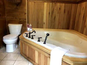 Jetted tub, towels, toilet paper