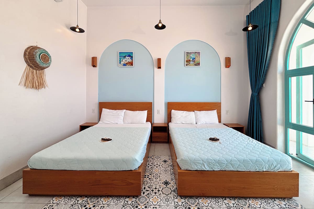 Deluxe Quadruple Room, Balcony, Garden View | Blackout drapes, soundproofing, iron/ironing board, free WiFi