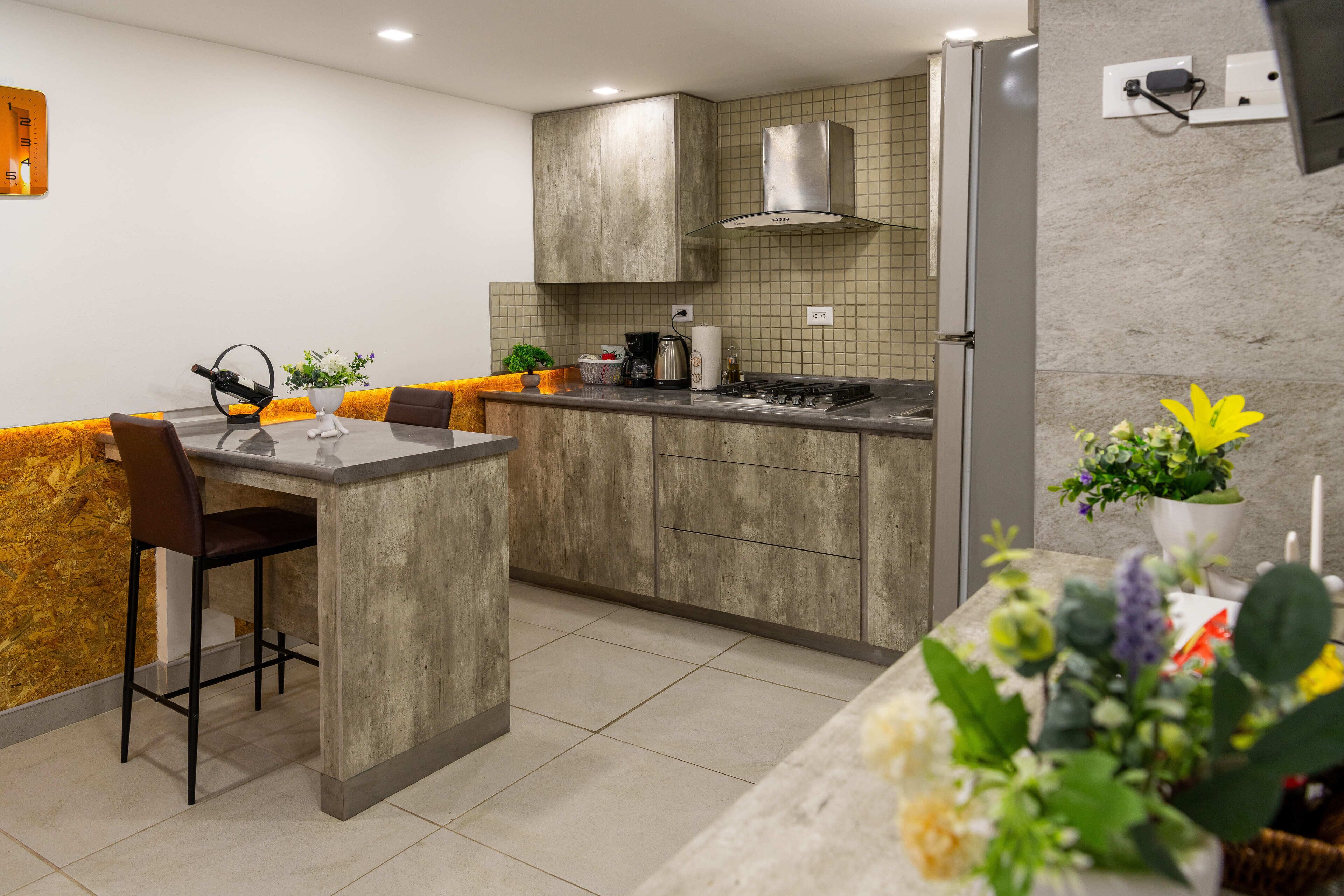 Fridge, microwave, stovetop, coffee/tea maker