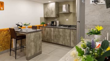 Fridge, microwave, stovetop, coffee/tea maker