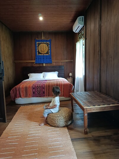 A traditional wooden house far from the rat race in the real Bali.