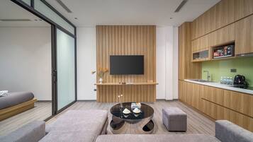Minibar, desk, laptop workspace, iron/ironing board
