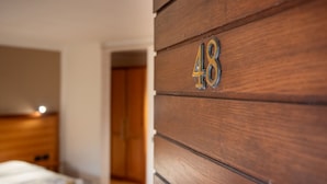 A wooden wall with the number '48' indicating a room number. - Tenuta dell'Argento - Room 8 by Rentbeat  (Civitavecchia)