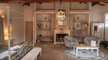 Luxury Suite, Pool View | Down comforters, minibar, individually decorated, individually furnished