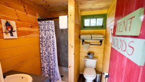 A compact wooden cabin with a shower, toilet, and sink. - Adult Only Bell Tent Perfect for a Romantic Getaway in Turner, Maine (Turner)