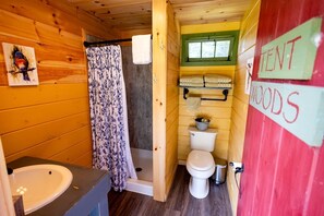 A compact wooden cabin with a shower, toilet, and sink. - Adult Only Bell Tent Perfect for a Romantic Getaway in Turner, Maine (Turner)