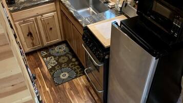 Fridge, stovetop, coffee/tea maker, cookware/dishes/utensils