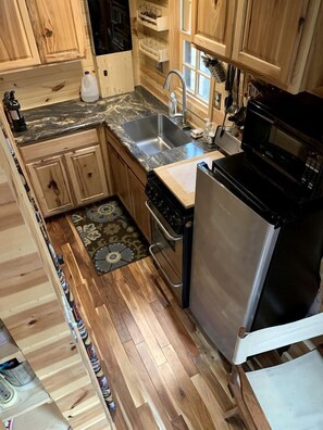 Fridge, stovetop, coffee/tea maker, cookware/dishes/utensils