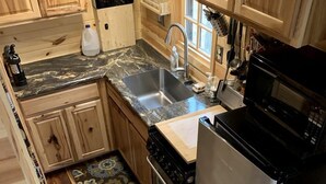 Coffee/tea maker, fridge, oven, stovetop - Many Pines Tiny House in in Chetek, WI (Chetek)