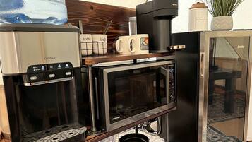 Fridge, oven, coffee/tea maker, cookware/dishes/utensils