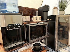 Fridge, oven, coffee/tea maker, cookware/dishes/utensils