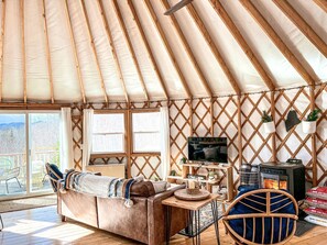 TV, fireplace - Incredible Spacious Yurt with Hot Tub and Fire Pit Surrounded by Nature for an Unforgettable Glamping Experience in Woodstock, Maine (Woodstock)