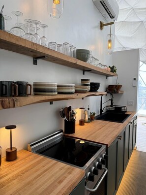 Fridge, stovetop, coffee/tea maker, cookware/dishes/utensils