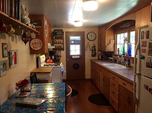 Fridge, microwave, stovetop, coffee/tea maker