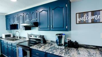 Fridge, stovetop, coffee/tea maker, cookware/dishes/utensils