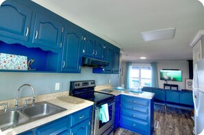 Fridge, stovetop, coffee/tea maker, cookware/dishes/utensils