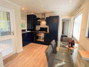 Cottage | Private kitchen | Fridge, microwave, cookware/dishes/utensils