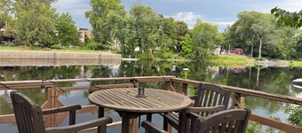 Riverfront 2-bedroom house with tons of light, AC, deck & patio. Pet Friendly