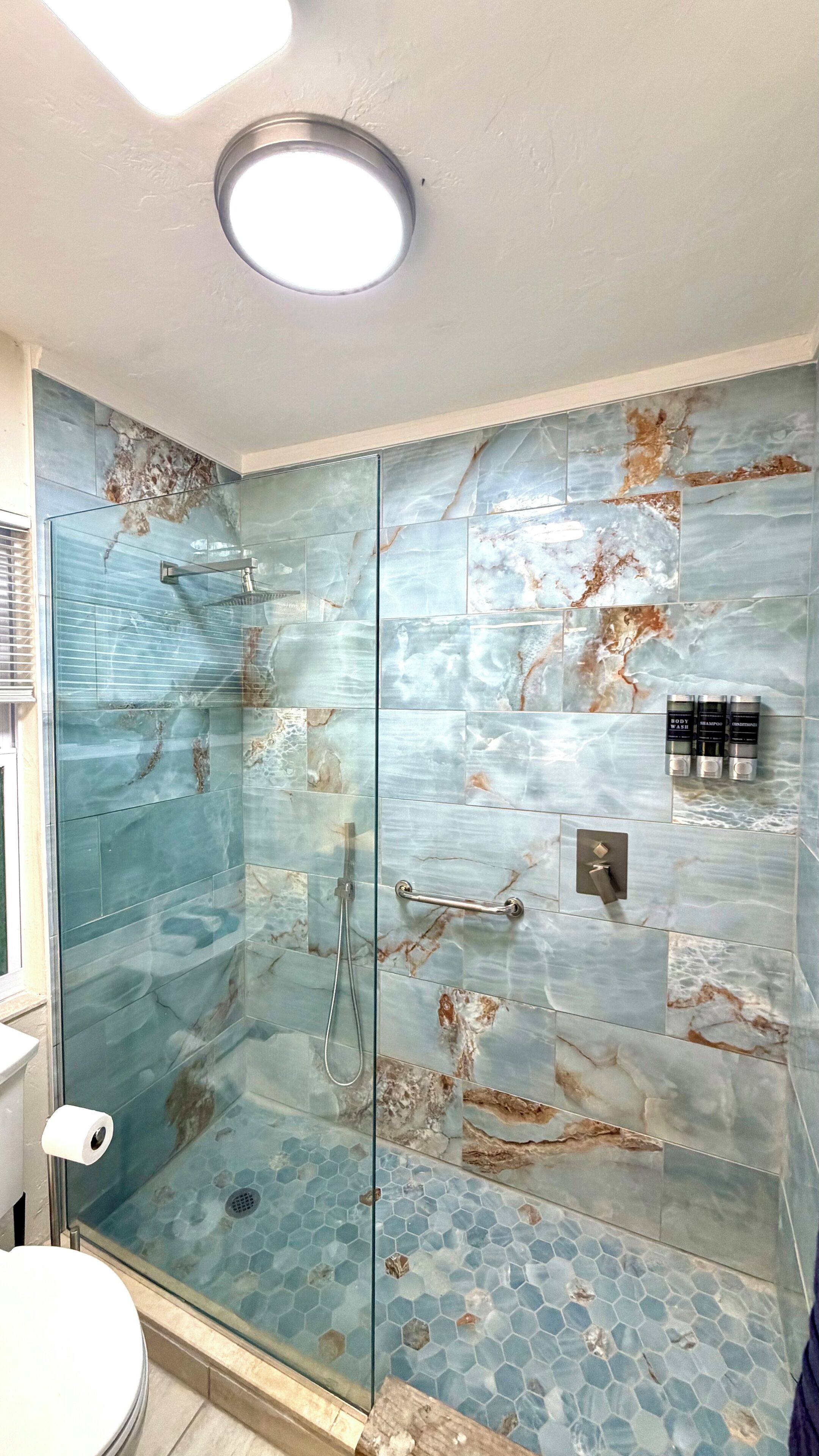 Shower, hair dryer, towels, soap