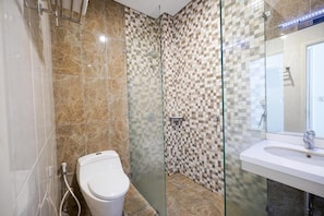 Shower, free toiletries, slippers, soap