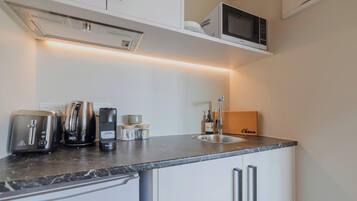 Fridge, microwave, coffee/tea maker, toaster