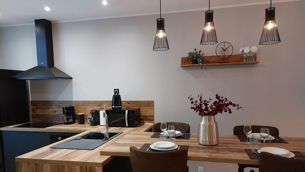 A modern kitchen with a central island, wooden bar stools, and pendant lighting. - B As in... Forest walk (Saint-Amand-les-Eaux)