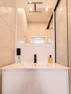 Shower, hair dryer, towels, soap