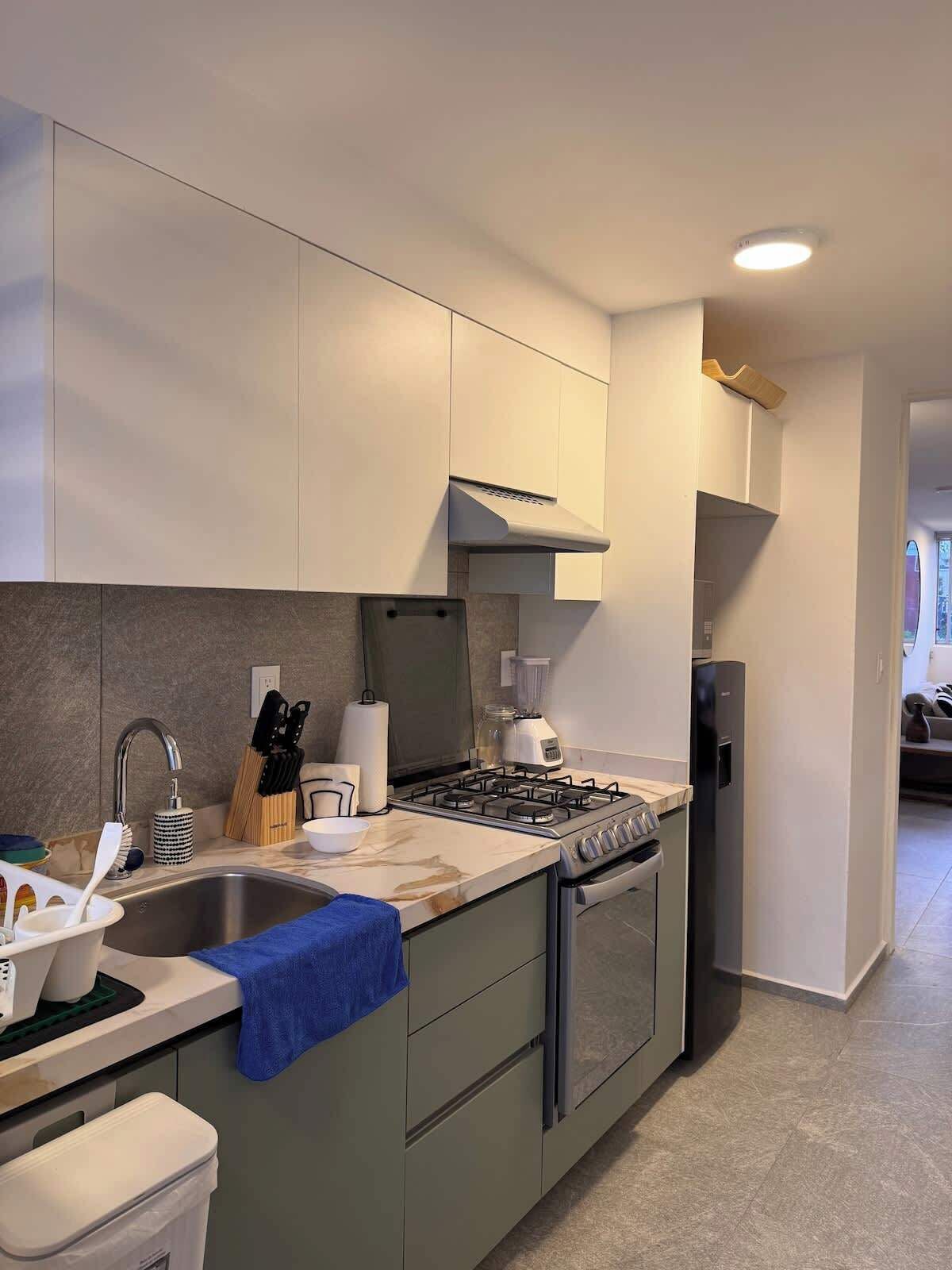 Fridge, microwave, stovetop, coffee/tea maker