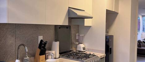 Fridge, microwave, stovetop, coffee/tea maker